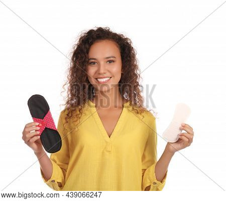 Young African American Woman With Reusable Menstrual Pad And Pantyliner On White Background