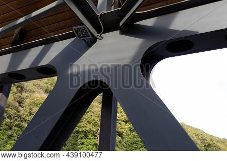 A Fragment Of A Metal Structure Of A Pedestrian Crossing Over A River Or Highway. Angular Connection