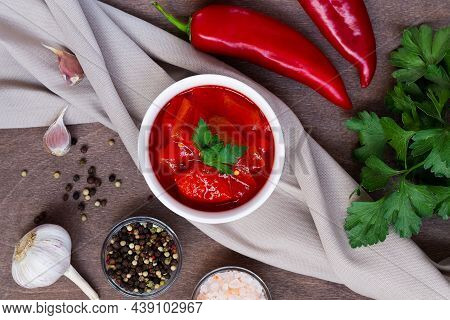 Top View Of Lecho Of Tomatoes And Sweet Paprika With Ingredients On The Table. Lecso National Dish O