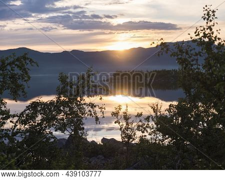Beautiful Pink Golden Light Sunrise At Lake Dam On River Lulealven In Saltoluokta In Sweden Lapland.