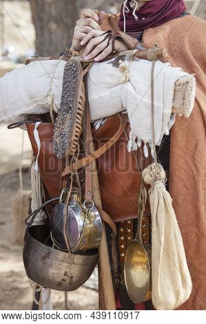 Reenactor Roman Soldier Holds Marching Pack. Furca Or Marching Pole For Carrying Supplies And Equipm