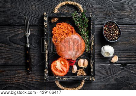 Mallorcan Sobrassada Cured Pork Meat Sausage In A Wooden Tray. Black Wooden Background. Top View