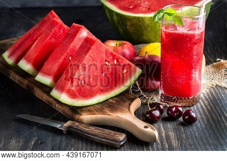 Fresh Watermelon Juice With Ice In A Glass. Slices Of Watermelon On The Table.fresh Watermelon Juice