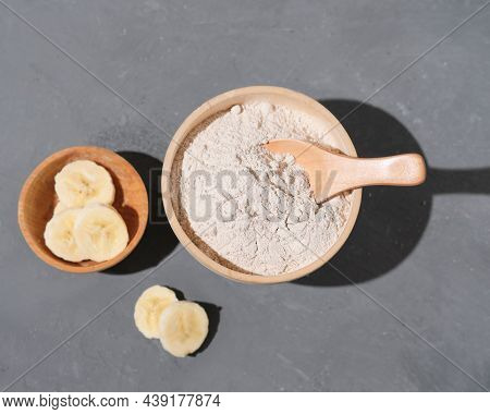 Green Banana Flour In Wooden Bowl And Sliced Banana. Alternative Flour, Gluten Free, Healthy Meal, B