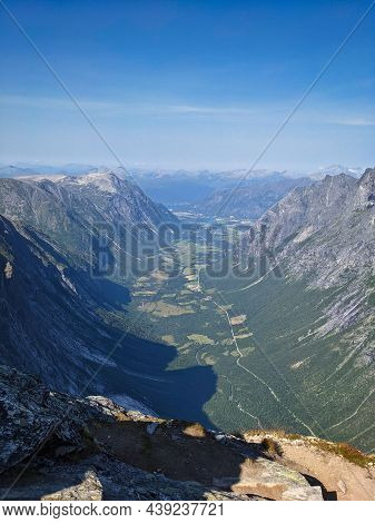 Hiking On The Norwegian Mountain Bispen Above Bispevatnet And Trollstigen Street. Travel In Scandina