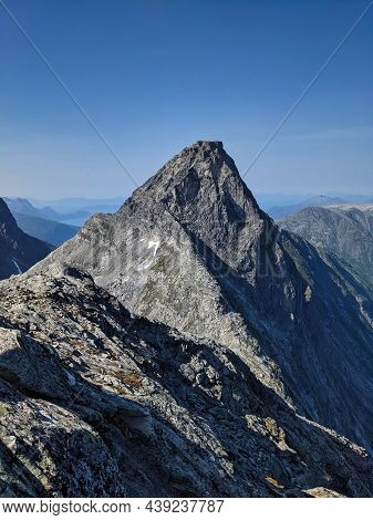 Hiking On The Norwegian Mountain Bispen Above Bispevatnet And Trollstigen Street. Travel In Scandina