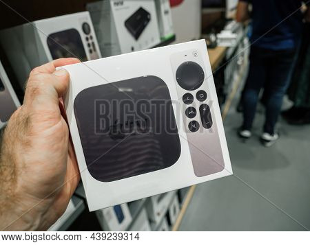 Paris, France - Sep 24, 2021: Male Hand Customer Holding Buying Package With The Enw Latest Apple Co