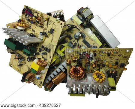 Non-working Printed Circuit Boards Of Computer Power Supplies With Radio Components On A White Backg