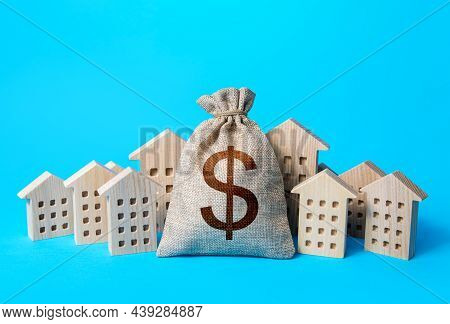 Dollar Money Bag And Residential Buildings. Municipal Budgeting. Rich City. Tax Collection, Investme