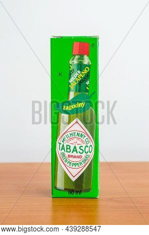 Pruszcz Gdanski, Poland - July 31, 2021: Box Of Milder Jalapeno Tabasco Sauce On Wooden Table. Mcilh