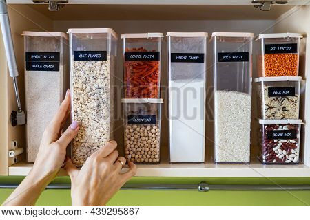 Storage Pasta In Boxes Use Konmari Method At Wooden Cupboard In Kitchen. Placing, Sorting, Keeping