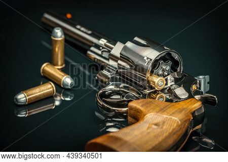 Close Up Of An Historical Revolver With Bullets