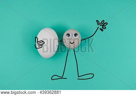 Animated Pebble With A Happy Face, Greeting All And Holds One Clear White Egg On Blue Paper Backgrou