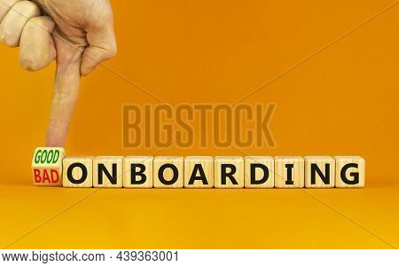 Good Or Bad Onboarding Symbol. Businessman Turns A Cube And Changes Words 'bad Onboarding' To 'good 