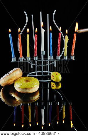 Happy Hanukkah And Hanukkah Sameach - Traditional Jewish Candlestick With Burning Candles And Donuts