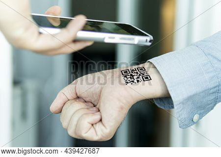 Hand With Qr Code On Wrist. Future Of Political Population Control. Chipization Of People. Scan The 