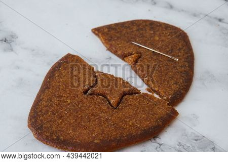 Kiev Ukraine - October 2021 Playing Korean Dalgona Or Ppopgi Honeycomb Candy From Squid Game Challen