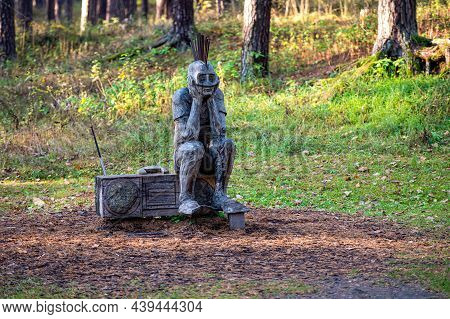 Riga, Latvia, October 30, 2021: Punk Sitting On A Radio, Sculpture By Lithuanian Sculptor Tautvils P
