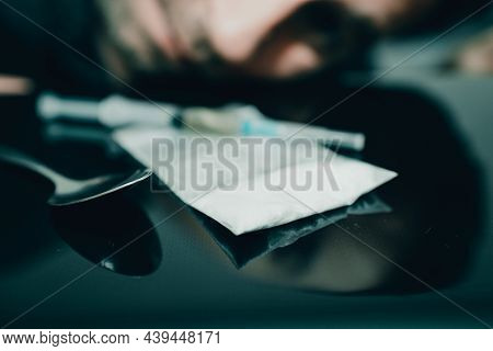Syringe, Drugs, Heroin,plastig Bag.closeup Of Narcotic Drug Syringe And Cocaine Or Heroine.man's Hea