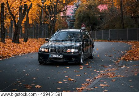 Riga, Latvia-october 6, 2021: Front View Of Black Bmw 330d In The City Street During The Beautiful A