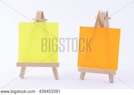 Two Wooden Easels Miniature With Blank Colored Square Canvas Or Memo Paper - Mockup. Mini Wooden Sta
