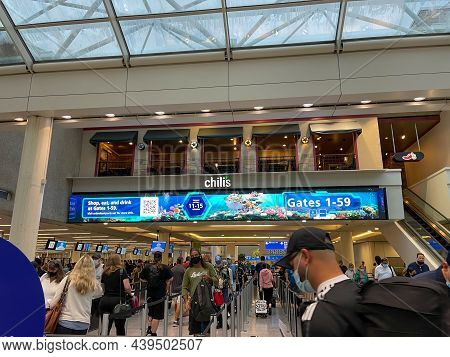 People Walking Through The Security Line At Orlando International Airport Mco.