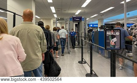 People Walking Through The Security Line At Orlando International Airport Mco.