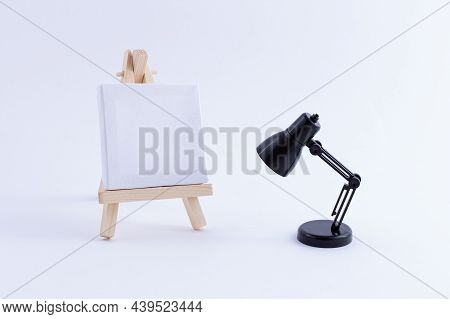 Wooden Easel Miniature With Blank White Square Canvas For Artists And Painters - Mockup. Mini Wooden