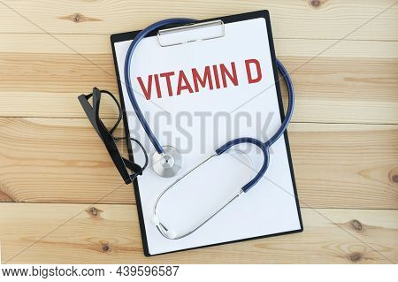 Vitamin D Word On Notebook, Stethoscope And Glasses