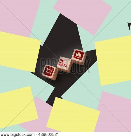 Wooden Cubes With The Text: Be Carefull And Icons Meaning Flamable And No Turing Upside Down. Beware