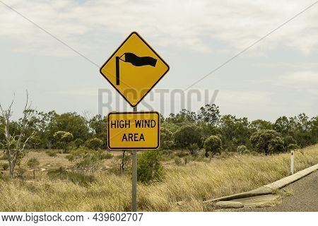 Roadside Signage Warning Of A High Wind Area Ahead