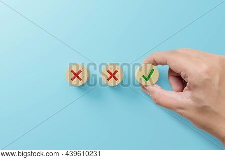 Checklist And Check Mark Concept. Check Mark And X Sign Symbol On Wooden Blocks On Light Blue Backgr