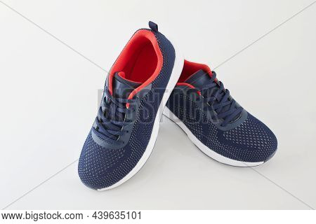 Pair Of New Unbranded Blue Running Shoes Or Sneakers On White Background. Fashion Sport Footwear Or 