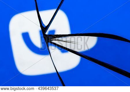 Kazan, Russia - Nov 13, 2021: Logo Of The Vkontakte Social Network In The Reflection Of A Broken Mir