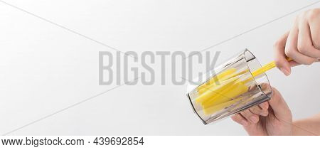 Clean And Wash Dish Concept. Man Hand Washing Drink Glass On White Background.