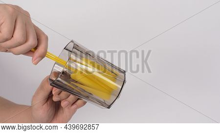 Clean And Wash Dish Concept. Man Hand Washing Drink Glass On White Background.
