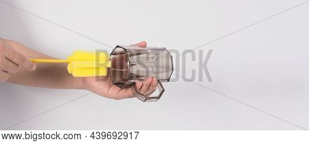 Clean And Wash Dish Concept. Man Hand Washing Drink Glass On White Background.