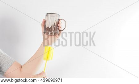 Clean And Wash Dish Concept. Man Hand Washing Drink Glass On White Background.