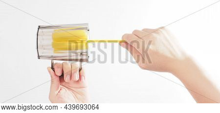 Clean And Wash Dish Concept. Man Hand Washing Drink Glass On White Background.
