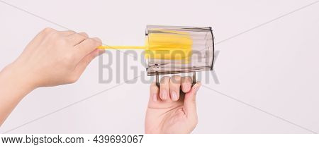 Clean And Wash Dish Concept. Man Hand Washing Drink Glass On White Background.