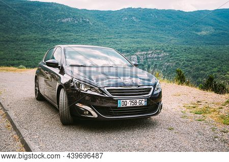 Verdon, France - June 29, 2015: Black Colour Peugeot 308 5-door Car On Background Of French Mountain