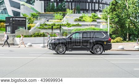 Lexus Lx450d Fast Moving On Highway Road. Overspeed In City Concept. Black Suv Car On City Road In M