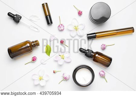 Spring Concept Of Natural Organic Cosmetics. Clean Brown Glass Cosmetic Bottles With Dropper, Cream,