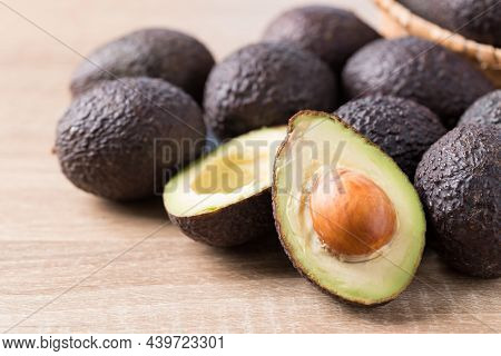 Ripe Hass Avocado Fruit On Wooden Background, Healthy Fruit