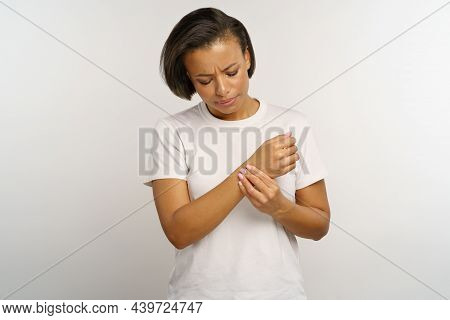 Upset Woman Hold Wrist In Pain From Using Computer And Uncomfortable Mouse. African Female Suffer Fr