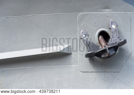 Ship Anchor On Grey Background. Rusty Detail Of Weathered Marine Tanker Bow. Old Metal Industrial Ba