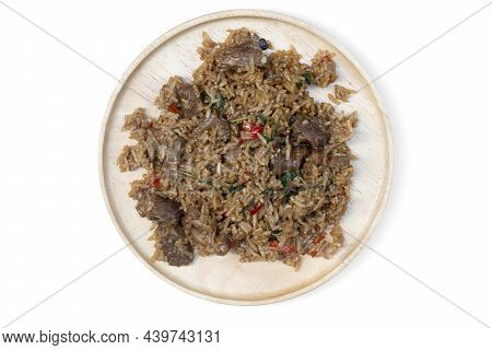 Above View Of Braised Pork With Basil Mixed With Rice. On A Flat Wooden Plate. With Isolated White B