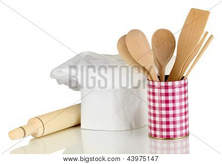 Kochmütze mit Löffel und Federballschläger, isolated on white