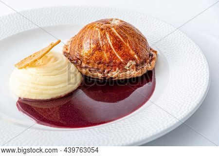 Tenderloin with pork, mushrooms and sirloin puff pastry on a white background. Homemade meal for wellington.