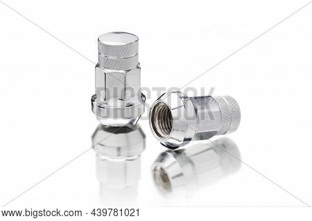 New Chrome-plated Seven-sided Wheel Nuts, Automotive Wheel Fasteners Isolate On A White Background